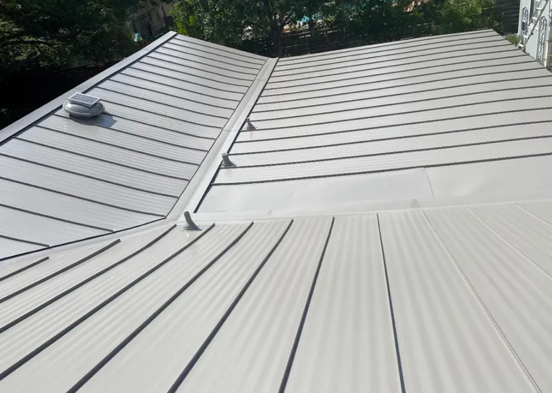 Solar attic fan installed on a metal roof for Roof Ventilation in Bensley